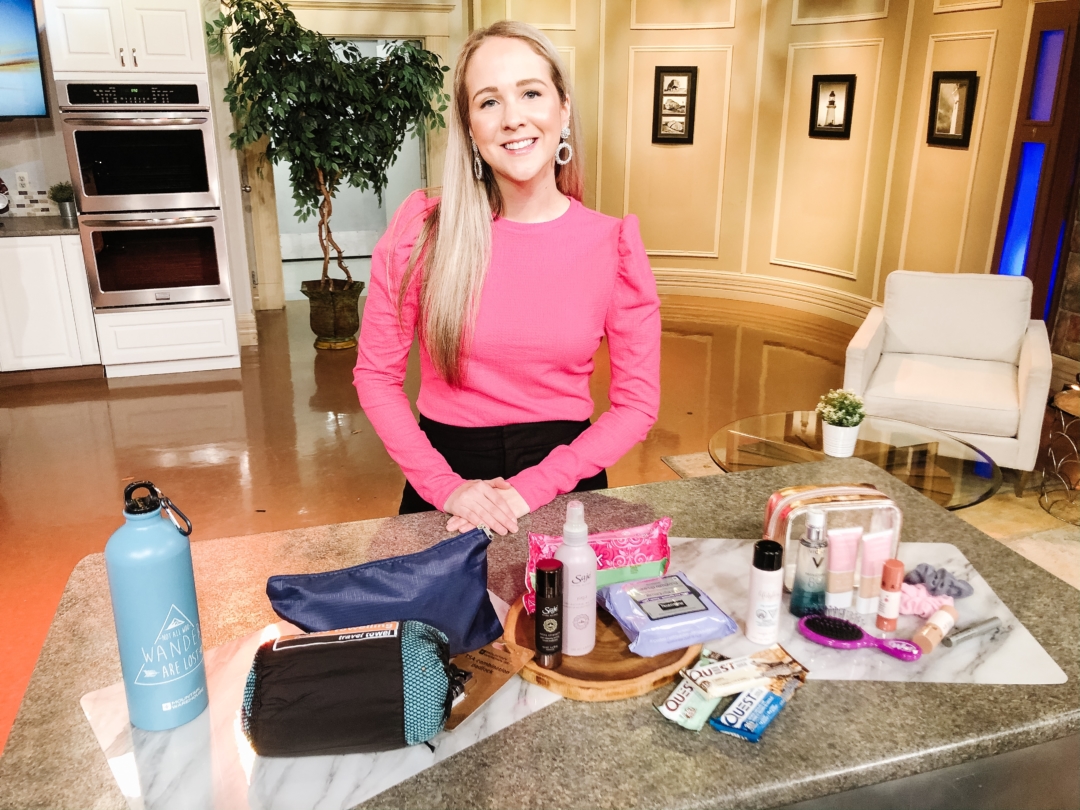 Lifestyle blogger Kayla Short poses at the CTV studio with her gym bag essential iteams